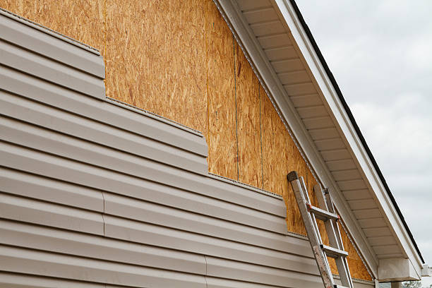Professional Storm Damage Siding Repair technician working in Donegal, PA